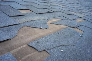 badly damaged shingle roof on a home in austin texas