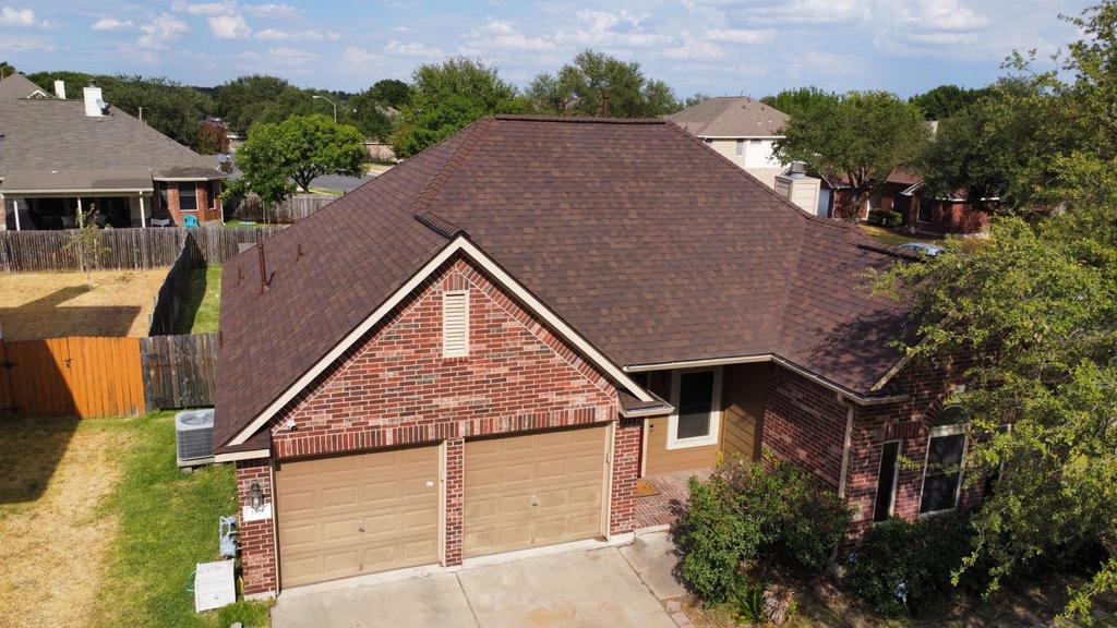 Austin home with a fresh new brown roof replacement 