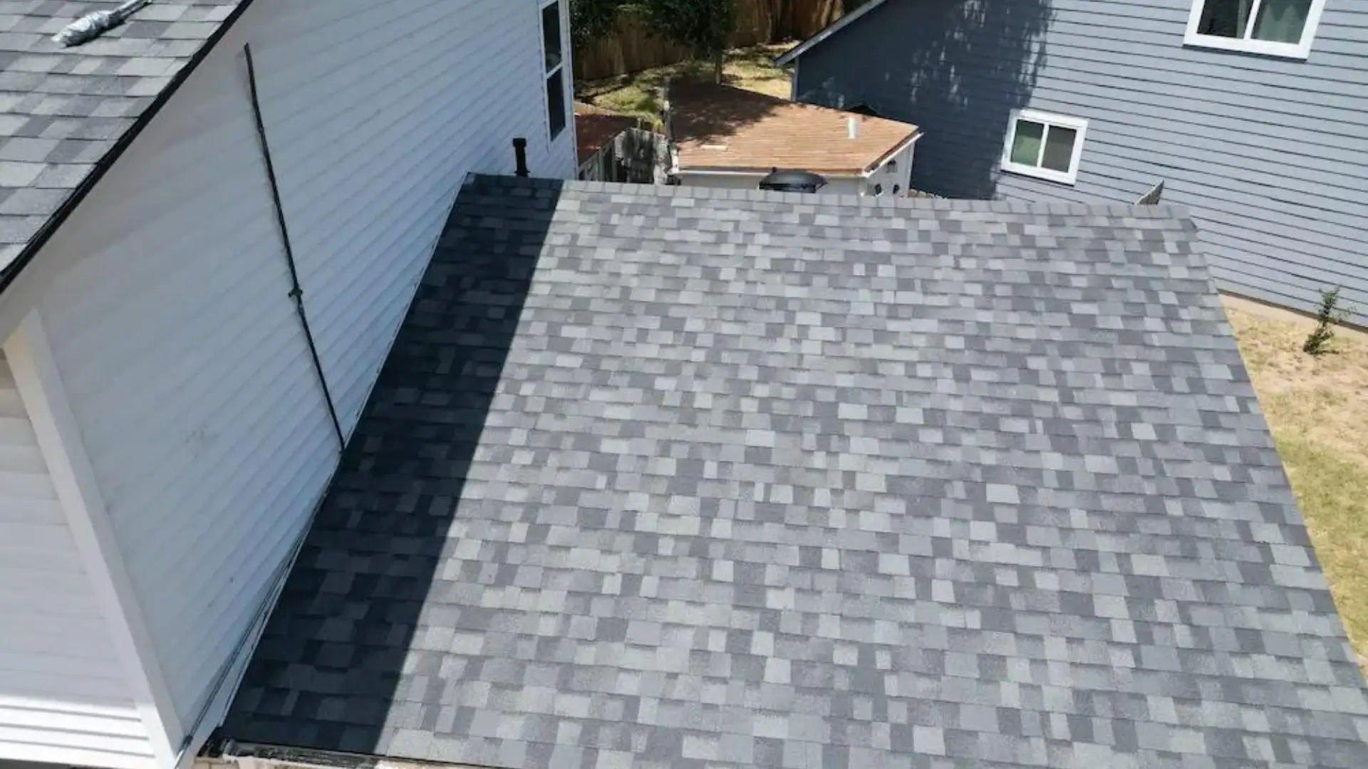 a commercial building with a gray flat roof
