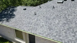 a residential building in austin with a brand new gray roof