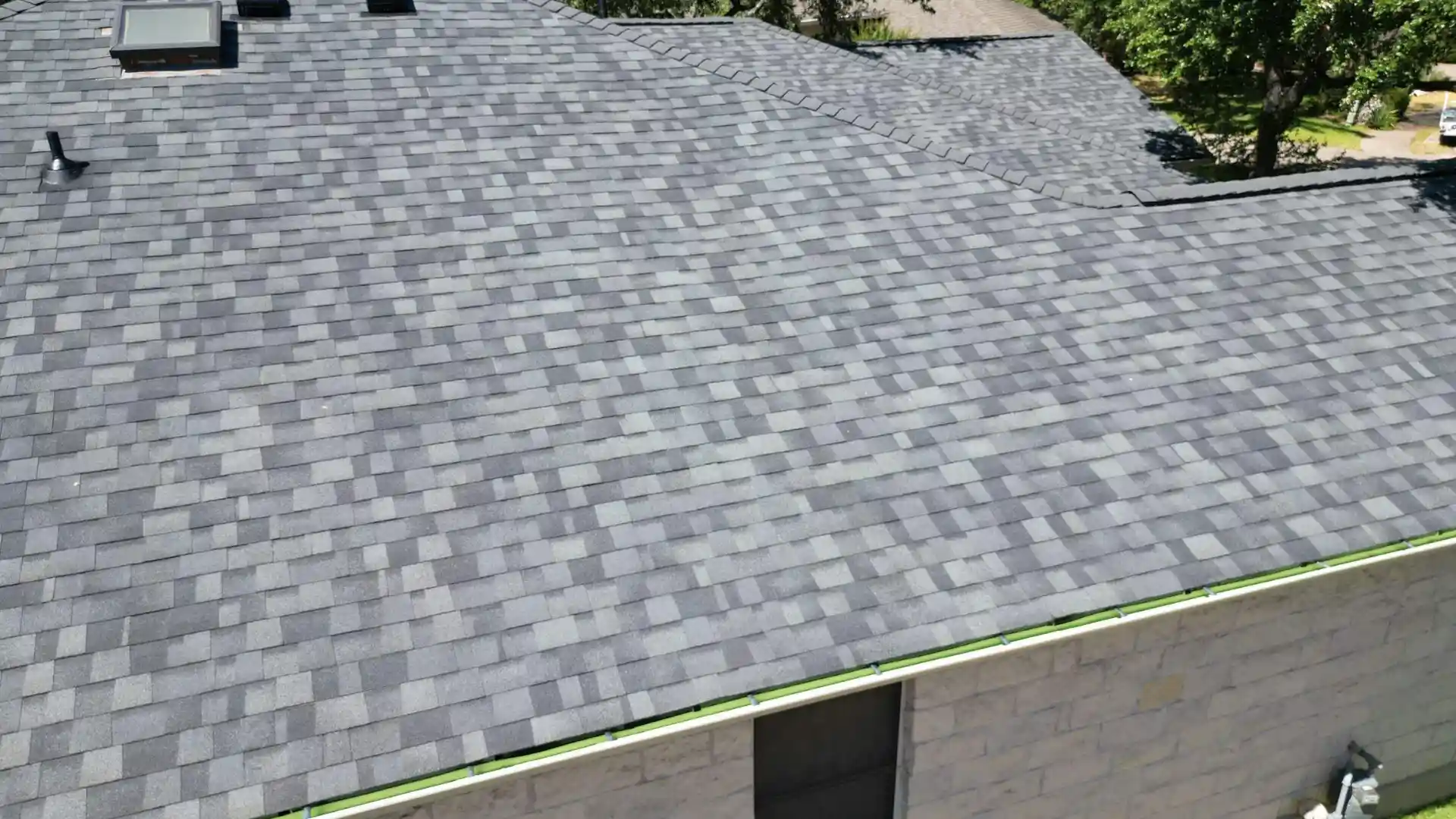 a home in austin texas with a gray shingle roof