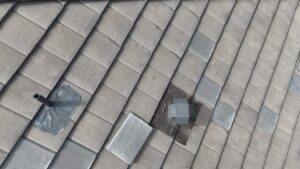 Tile roof showing areas of maintenance with visible repairs, including patches and fixtures, emphasizing the importance of upkeep for durability and aesthetics in Texas' climate.