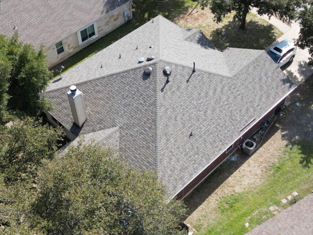 New asphalt shingle roof on brick home in Leander TX