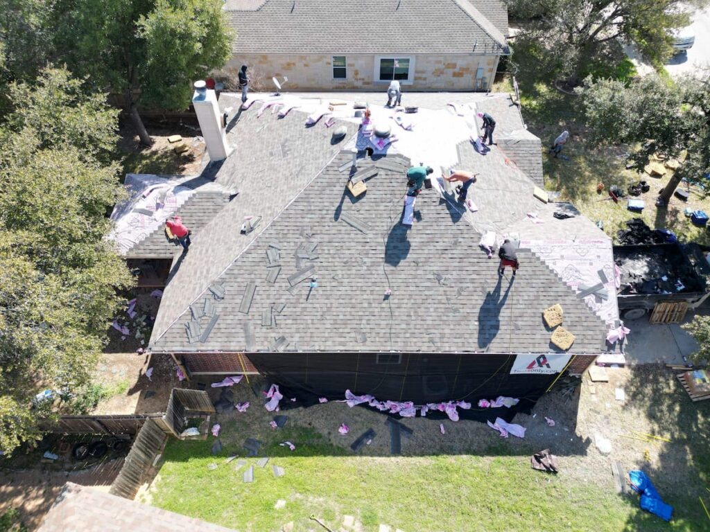 RoofsOnly.com roofing crew replacing a roof in Leander Texas
