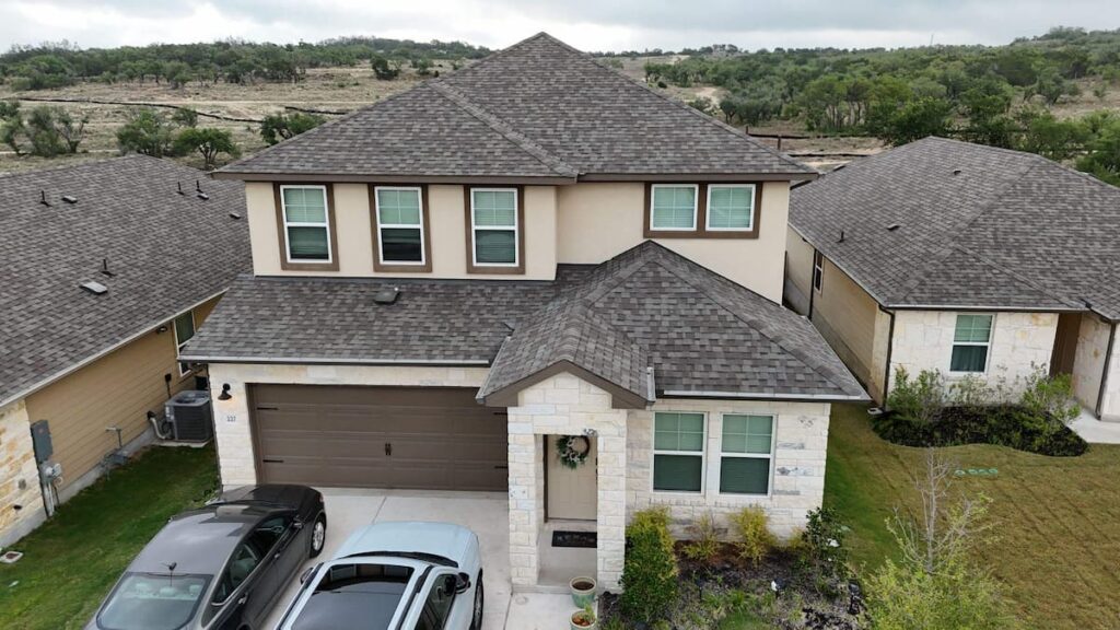 Completed shingle roof replacement on Hill Country home in Dripping Springs TX by RoofsOnly.com