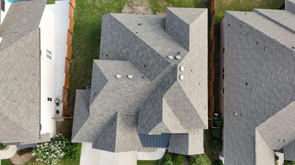 Aerial view of completed shingle roof replacement on acreage property in Dripping Springs TX by RoofsOnly.com