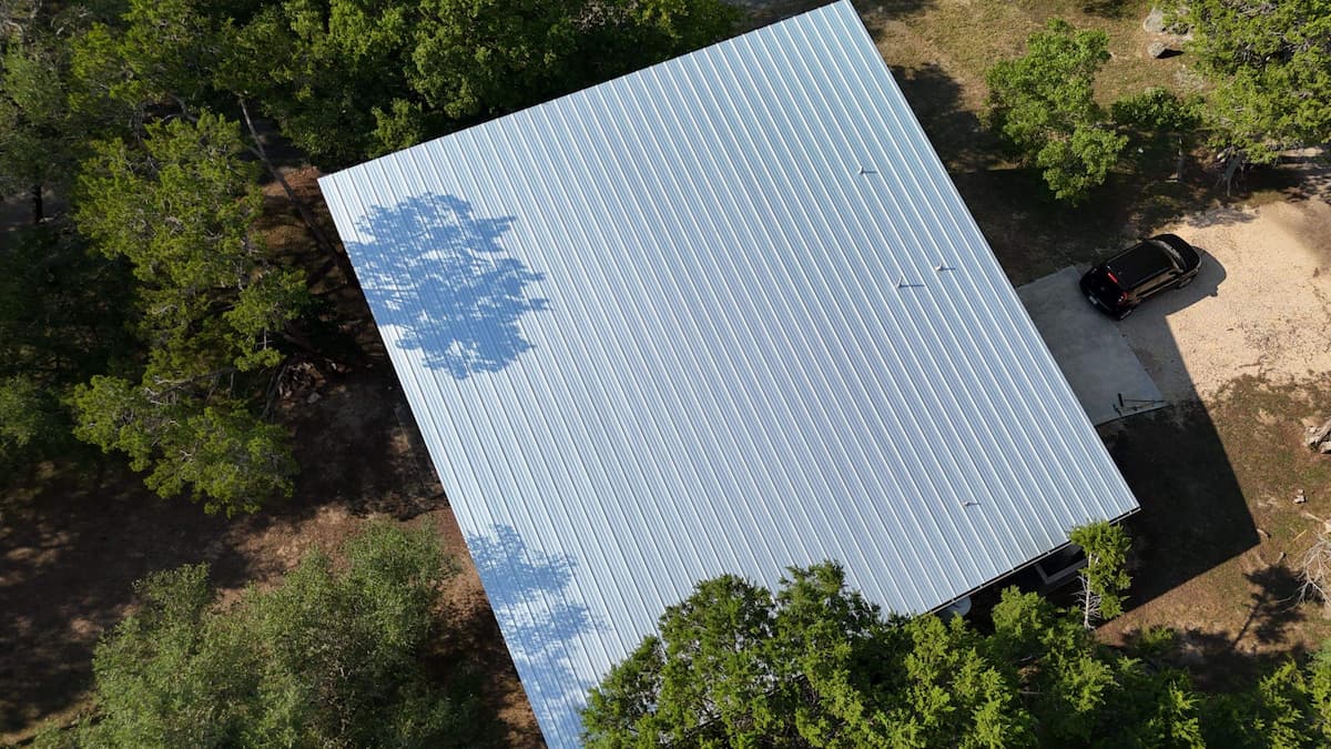 RoofsOnly.com crew finished install of standing seam metal roofing panels on Austin Texas home