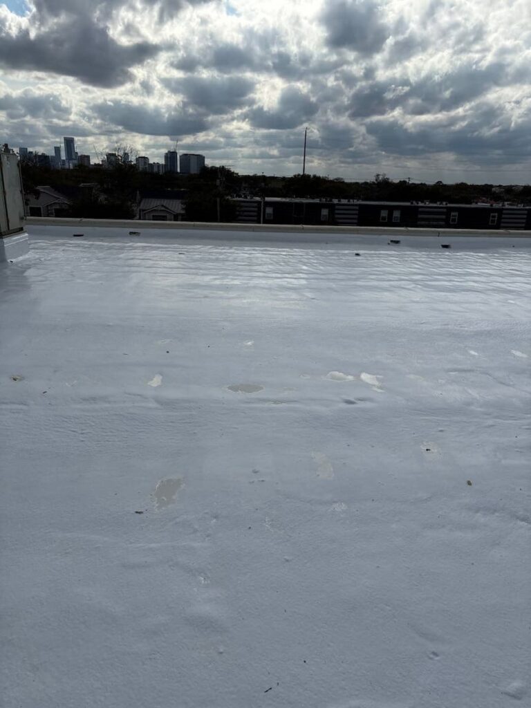 Ponding water on a flat roof identified during an inspection in Austin Texas