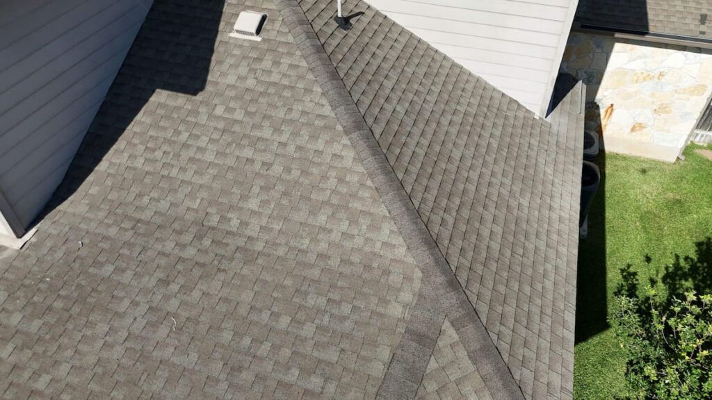 RoofsOnly.com inspector documenting hail damage on a residential roof in Round Rock Texas