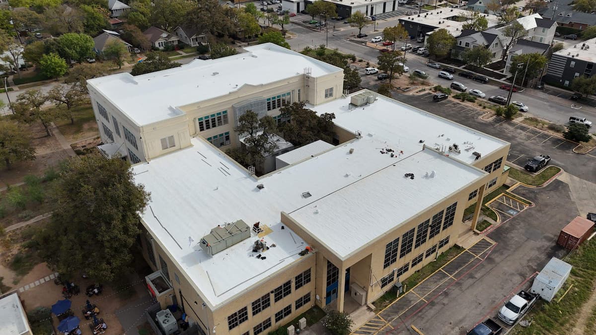 TPO membrane flat roof seam repair on an Austin Texas commercial property by RoofsOnly.com