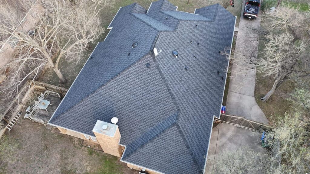 Completed architectural shingle roof on a home in Buda TX
