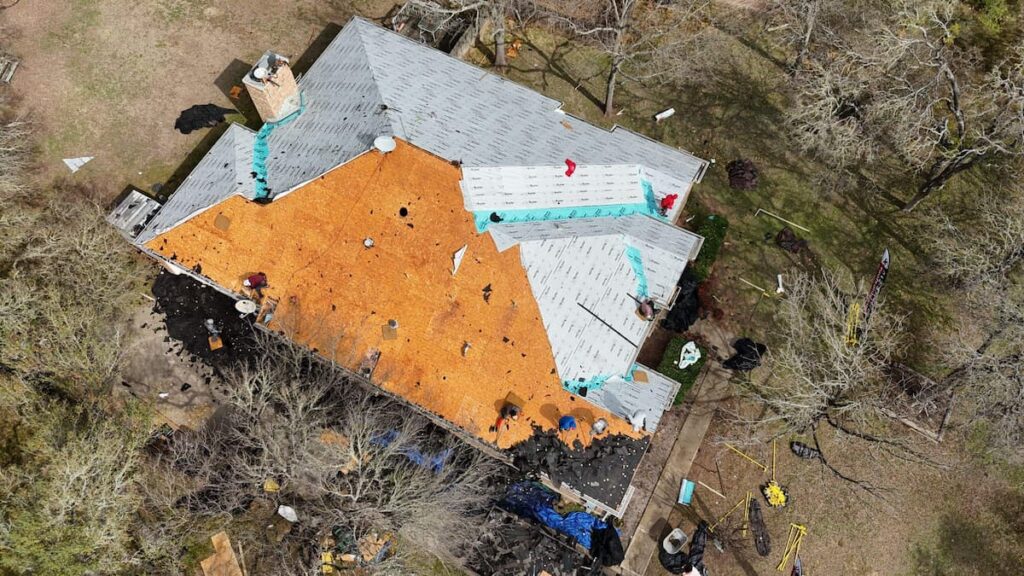 RoofsOnly.com crew installing underlayment during a roof replacement in Buda TX