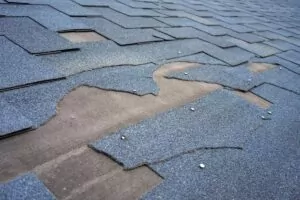 badly damaged shingle roof